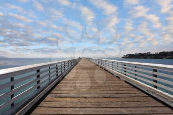 Wooden pier with handrails. Pacific Coast, California, USA
