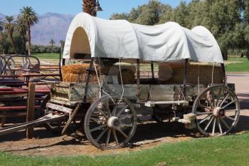 The open air museum. Restored antique wagon of the first settlers in the oasis in Death Valley