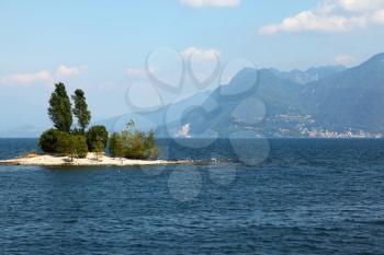 Charming small island in Lake Maggiore, photographed with a tourist pleasure boat
