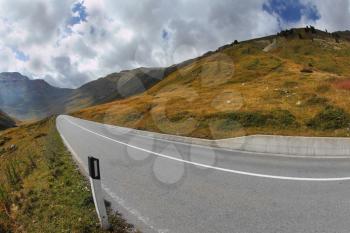 The magnificent mountain valley. Winding and dangerous road - the Serpentine. Photo taken by lens Fisheye