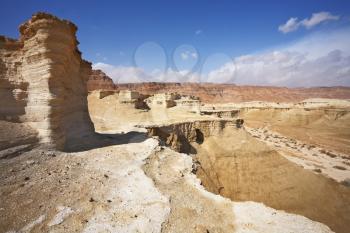 Natural canyons, bluffs and cliffs of sandstone in the desert near the Dead Sea in Israel 
