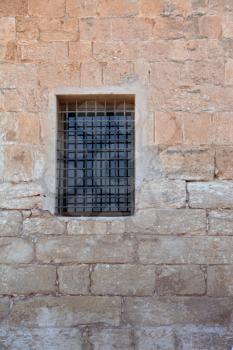 An ancient Crusader fortress. The window closed by a lattice