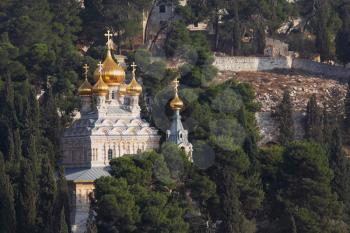 Golden domes of the Church of Mary Magdalene and cypresses. Mount of Olives, Jerusalem
