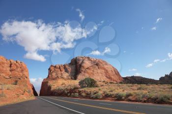 Magnificent American road among rocks of red sandstone