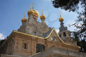 Church of Mary Magdalene in Jerusalem. Golden domes and creamy Jerusalem stone walls

