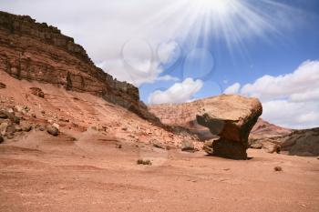 The American desert. The well-known huge mushroom from red sandstone and the dazzling midday sun
