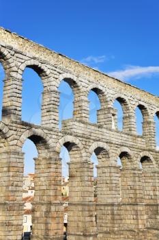 The well-known antique aqueduct and ancient Segovia in fine May day