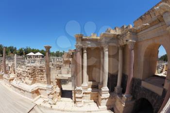 Stone columns and the scene in the Roman amphitheater at Beit Shean, Israel

