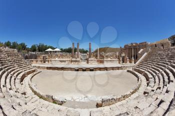 The stone seats and a stage in the Roman amphitheater at Beit Shean, Israel
