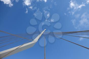 The new ultra-modern white bridge in Jerusalem. Strings suspension bridge and snow-reliance against the blue sky