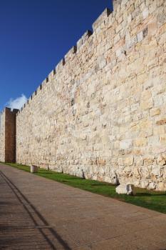 A lovely sunny day in Jerusalem. The walls  against the sky and clouds
