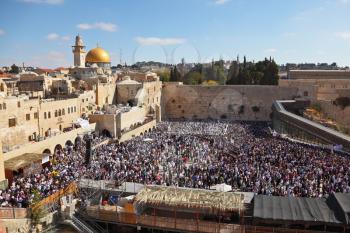 The most joyous holiday of the Jewish people - Sukkot. The Western Wall in Jerusalem temple. The area in front of it filled with people from morning prayers