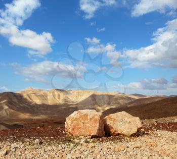 Magnificent transparent day in Judean desert. Huge boulders along highway, an unflawed sky