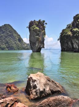 Fabulously beautiful landscape. Lovely island - rock in the shape of the vase James Bond. Closed lagoon into the ocean.