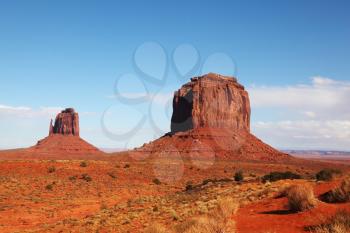 The majestic Monument Valley. Famous bright orange sandstone rock Mittens