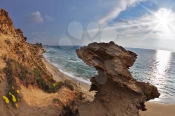 Freakish rocks on coast of Mediterranean sea shined by the sun