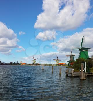 Ancient windmills and channels in museum ethnographic small town in Holland 