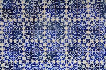 The magnificent medieval monastery in Portugal. A fragment of the wall, decorated with ceramic tiles azulezhu