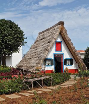 Cosy chalet with a triangular thatched roof. Madeira Island, the city Santana