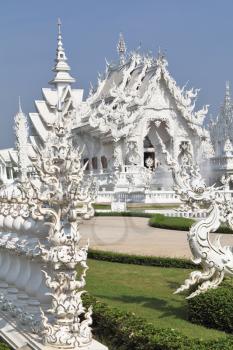 Incredibly perfect example of modern Thai architecture. Snow-white palace-museum, decorated with various sculptures in the traditional style


