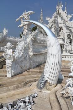 Incredibly perfect example of modern Thai architecture. Snow-white palace-museum, decorated with various sculptures in the traditional style