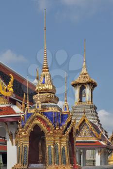 The overgilded tower with a bell and a tower-mortar in a royal palace in Bangkok
