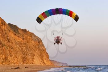 Flight on an operated parachute along coast of Mediterranean sea