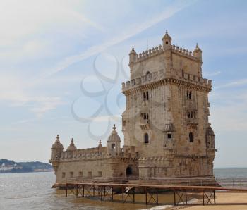 Lisbon's main attraction - the fortress of Belem. The white tower is decorated with stone laces in medieval style