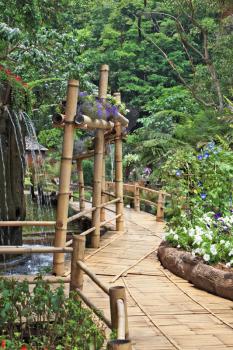 Gorgeous huge park on the island  Madeira. Bamboo path around the fountain