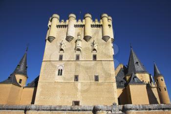 The central tower of an ancient Spanish palace shined by the sun