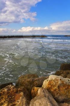 The winter sea. Coastal rocks on quay Tel Aviv 