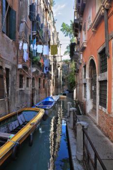  The narrow street channel. Picturesque laundry drying on clothesline. Gorgeous Venice