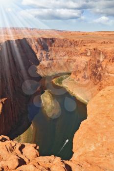 The sun illuminates the Horseshoe Canyon and Colorado River water in the stone desert Navajo Reservation