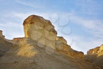 Hills of freakish forms from sandstone on a sunset