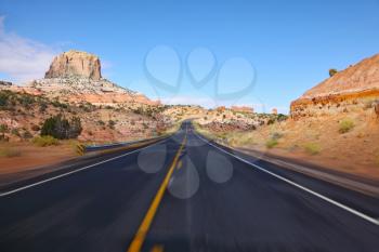 Tourism on high speed. The American highway in state of Utah, sunrise