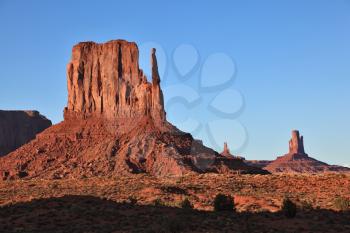 Dusk in Monument Valley. Famous red sandstone monoliths 