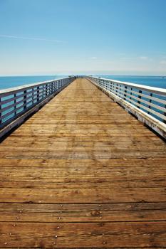 Wooden Pier at Pacific coast USA. Warm autumn day