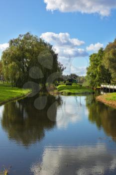 Charming park and the small channel in museum ethnographic small town in Holland