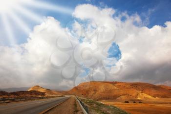 Automobile highway in desert Sinai in solar December day