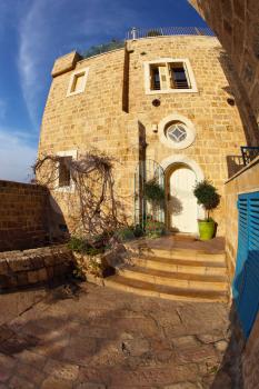 The ancient stone house in Old Yaffo. Warm day in December