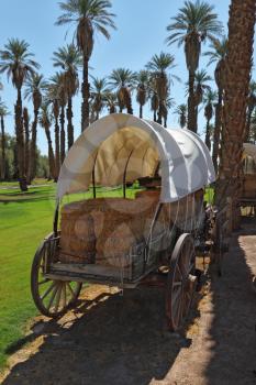 The open air museum. Restored antique wagon of the first settlers in the oasis in Death Valley