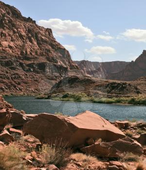 Magnificent Colorado River water is cold in the steep banks of red sandstone. Navajo Reservation, USA
