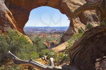  An arch in National park  Arches through which the panorama of a valley is visible