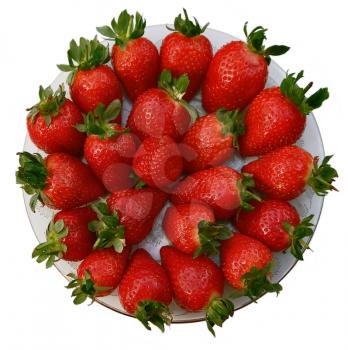  Some berries of a large ripe strawberry on a beautiful dish