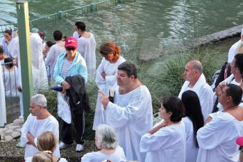 Yardenit, Israel - January 21: Baptism of Christian pilgrims in the holy waters of the Jordan River in the days of the Feast of Holy Baptism 21 January 2012 at Pilgrim baptismal site Yardenit, Israel.