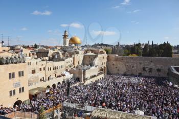 The Western Wall in Jerusalem temple. The area in front of it filled with people from morning prayers. The most joyous holiday of the Jewish people - Sukkot.
