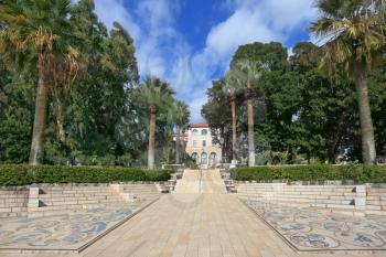 The luxurious park and marble stairs belong to Christian monastery on the Sea of Galilee