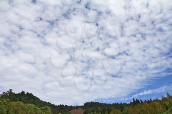Huge cloudy sky over the autumn hills