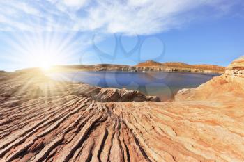 The midday sun in the turquoise water bay. Bottling magnificent Lake Powell photographed by Fisheye lens