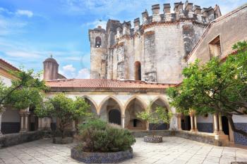 The imposing medieval castle - the monastery of the Templars. Cozy internal court yard with gallery. In the center a stone round bed.